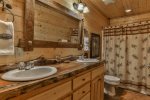 Main level queen master bathroom with shower/tub combo